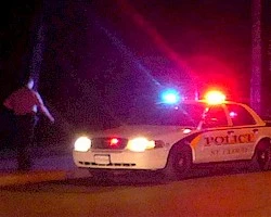 St. Cloud Police Car at Night with Officer