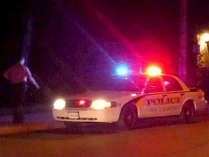St. Cloud Police Car at Night with Officer