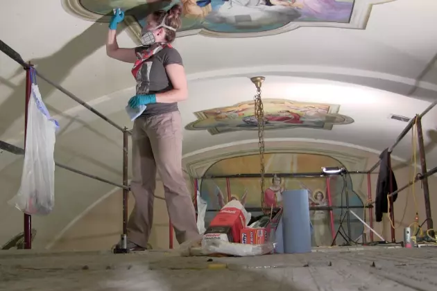 Art Conservators restore a 95-year-old painting. (Photo: Alex Svejkovsky, WJON)